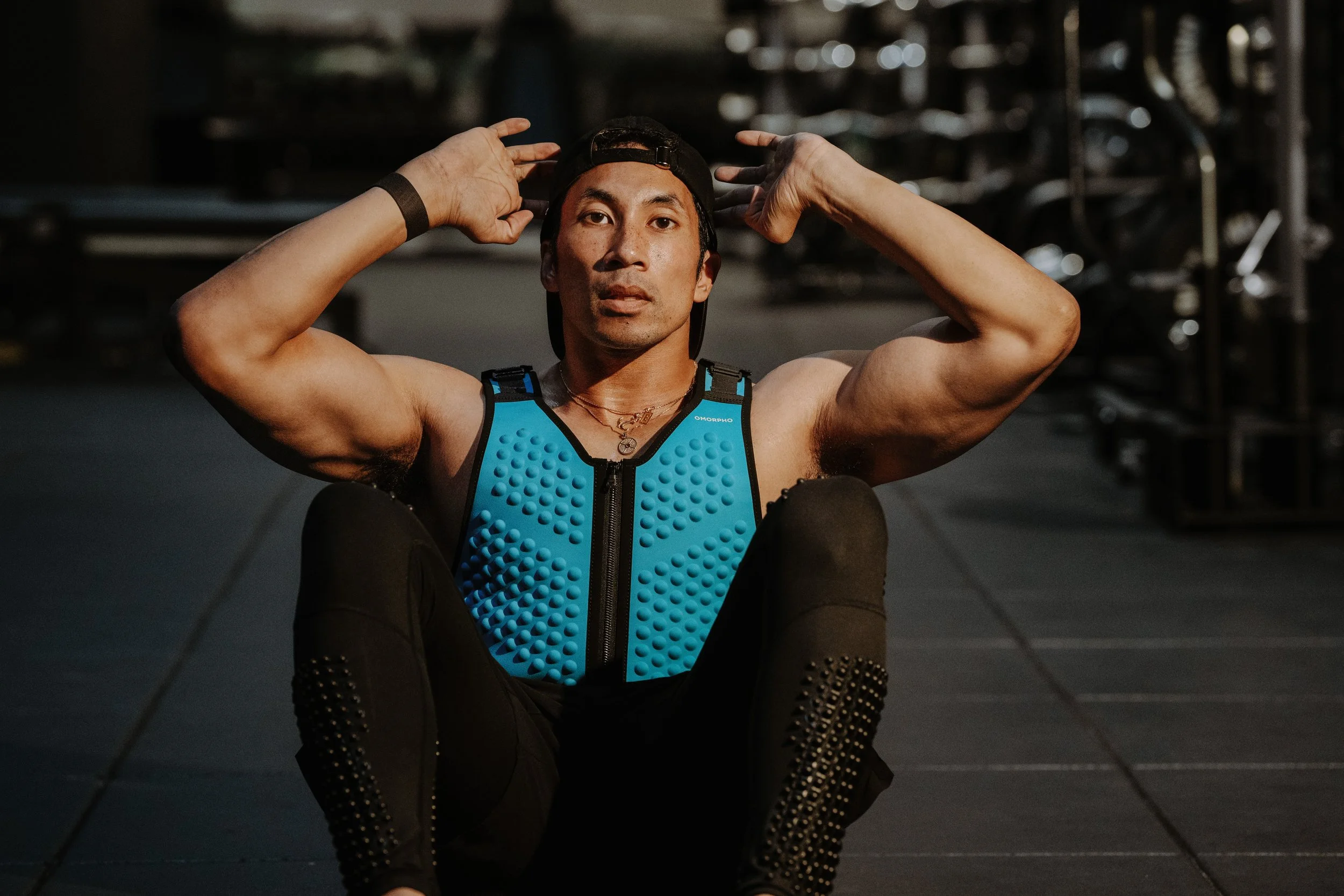 Close up of Eb Samuels in Omorpho Vest doing a situp