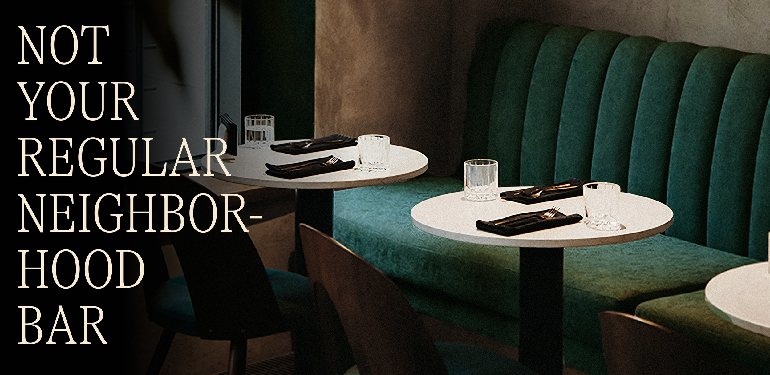 Photo of booths and tables with white text in all caps that reads "not your regular neighborhood bar"