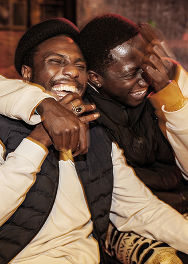 Two friends laughing together