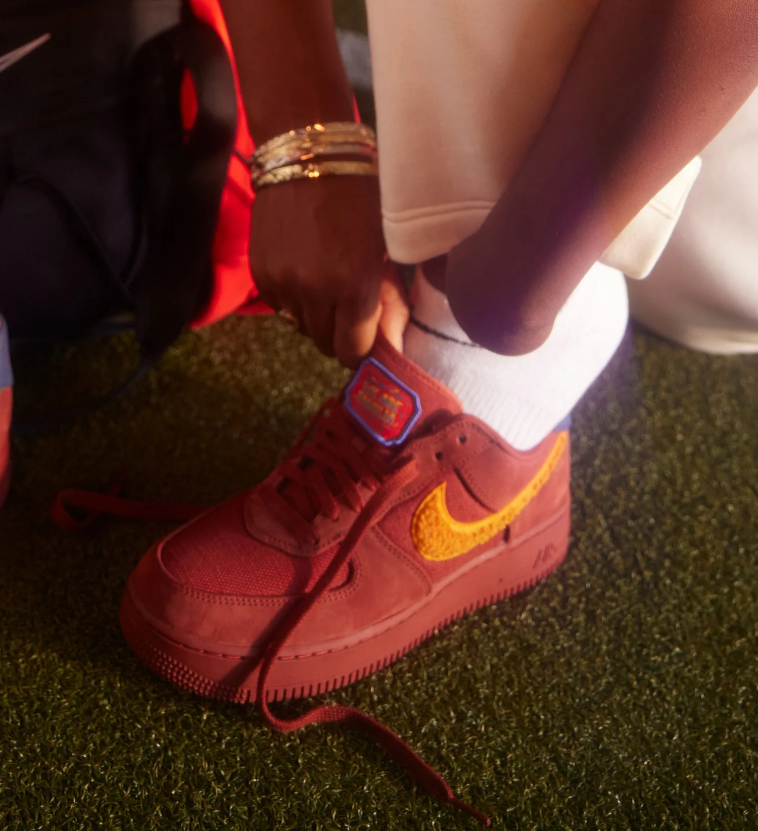 Red Nike Shoe being tied