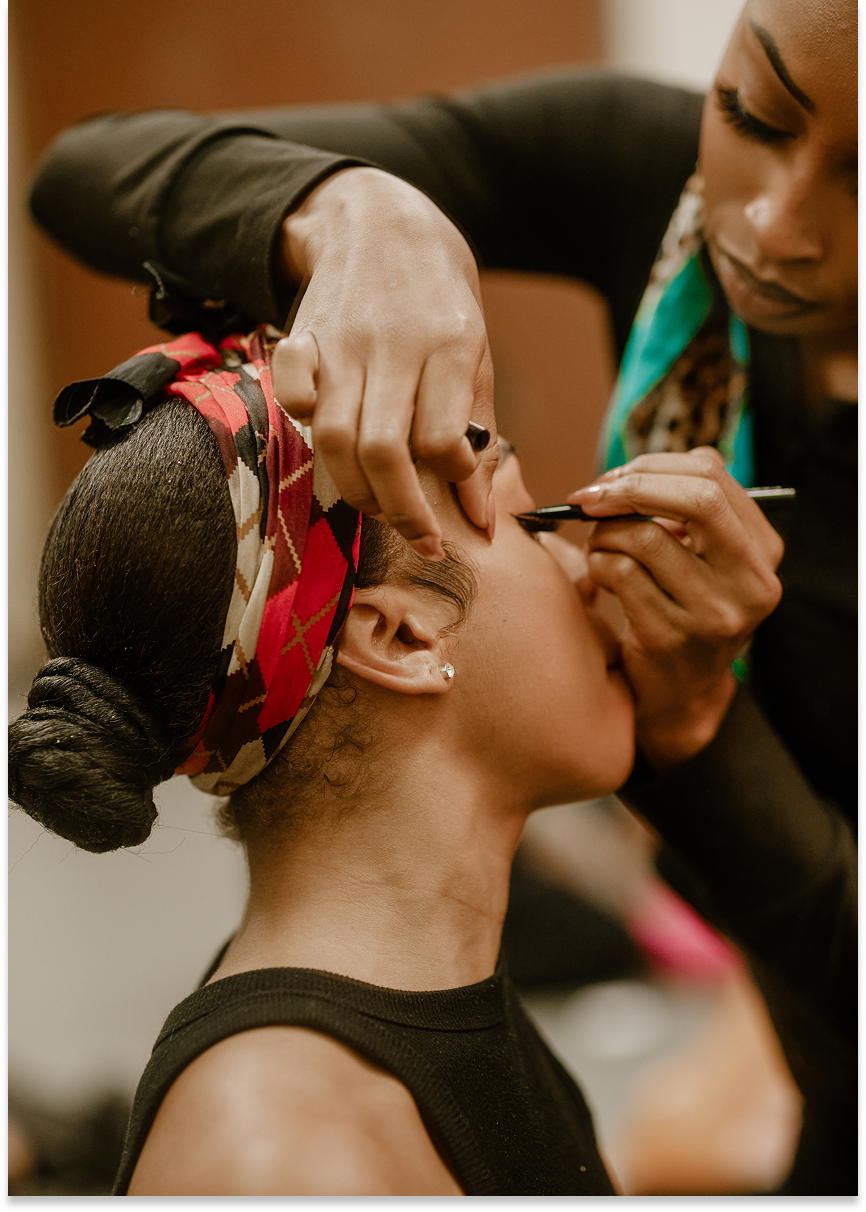 Girl putting on makeup on another girl