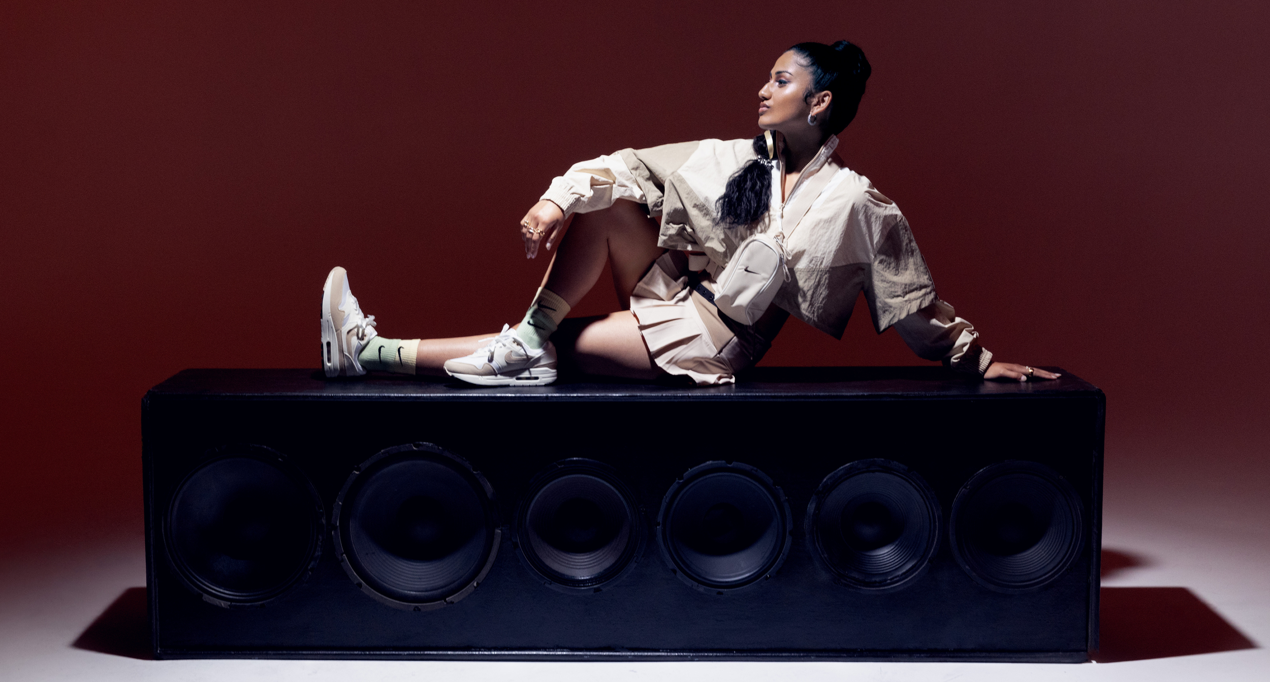 Ashley Mehta sitting across speaker