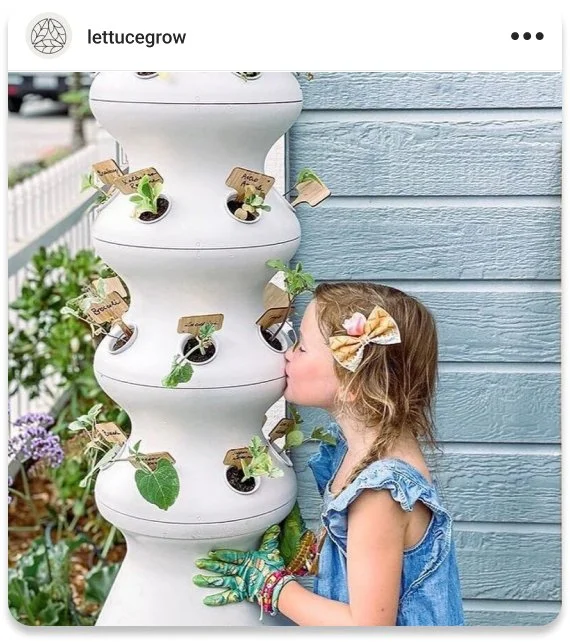 Instagram post for Lettuce Grow of a girl kissing a farmstand