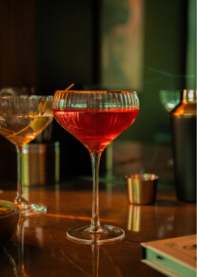 Red drink in glass on table