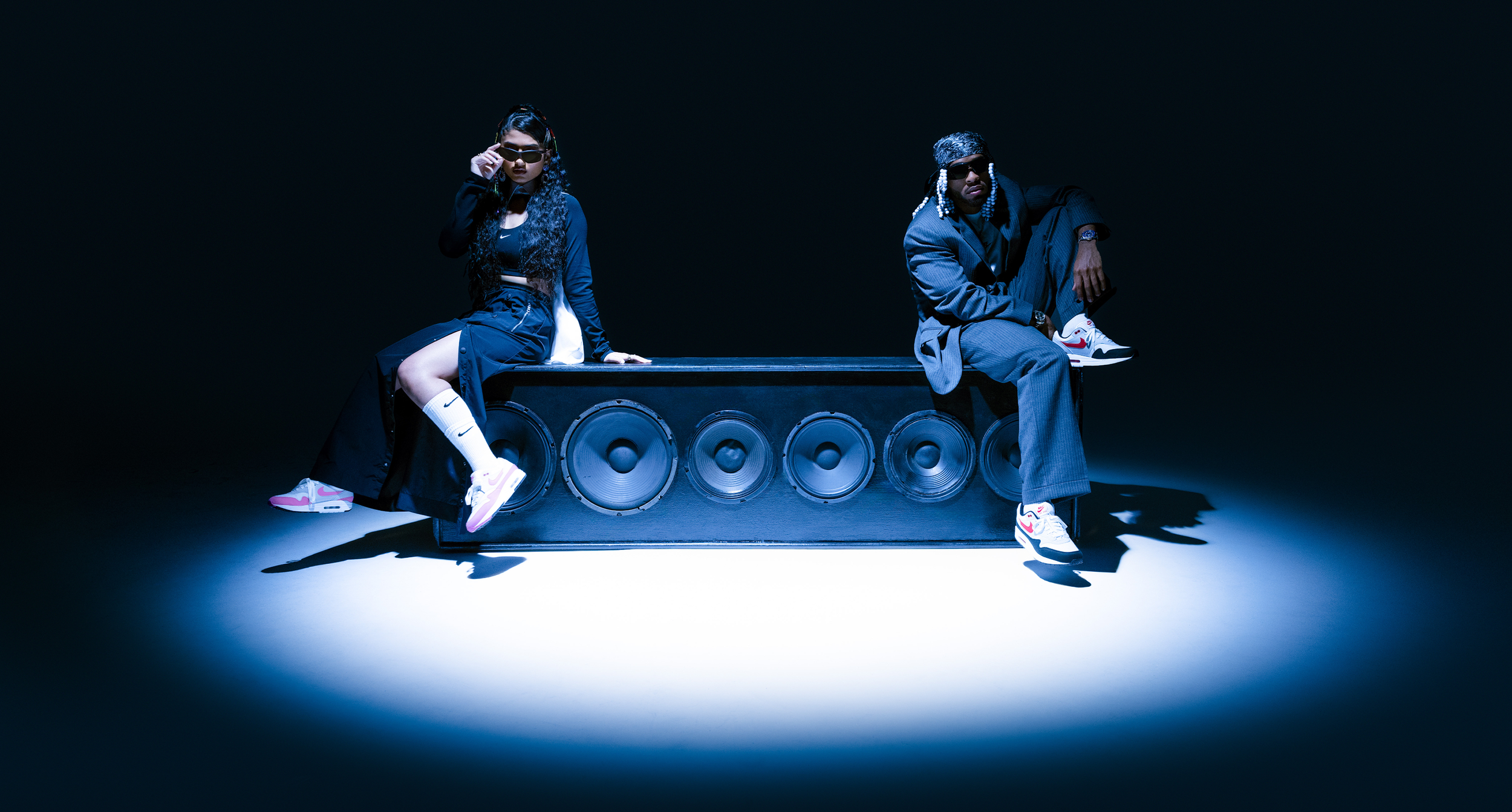 Armani and Ashley siting on speaker