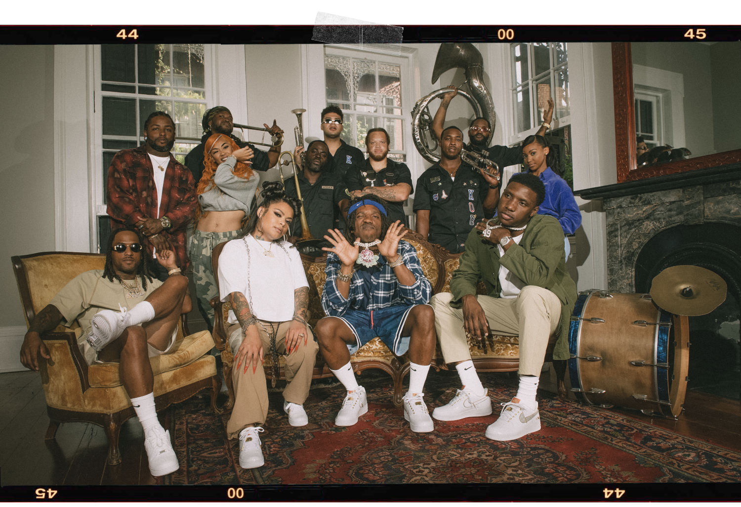 group of people in living room with instruments