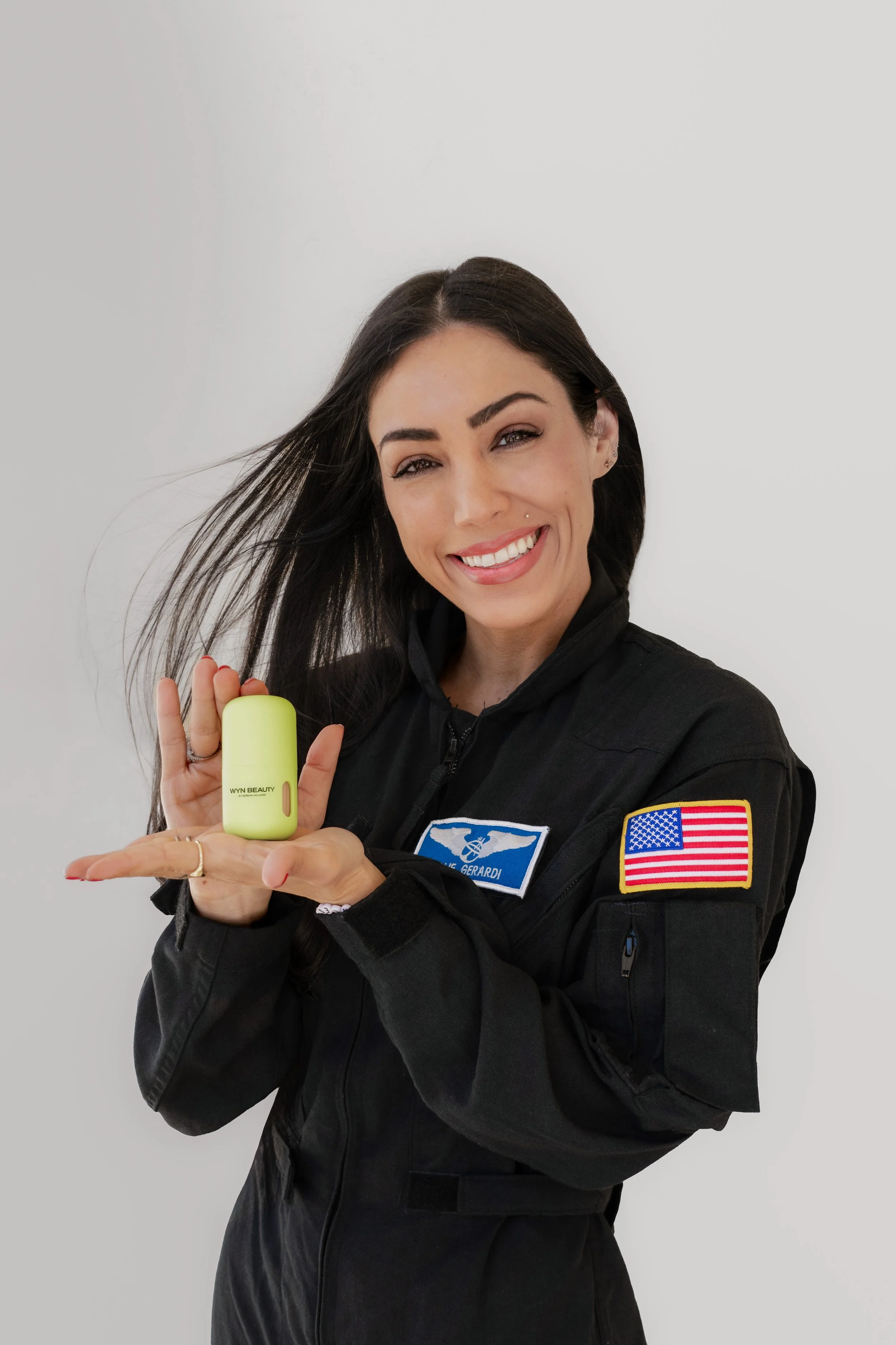 Kellie Gerardi holding Wyn Beauty product