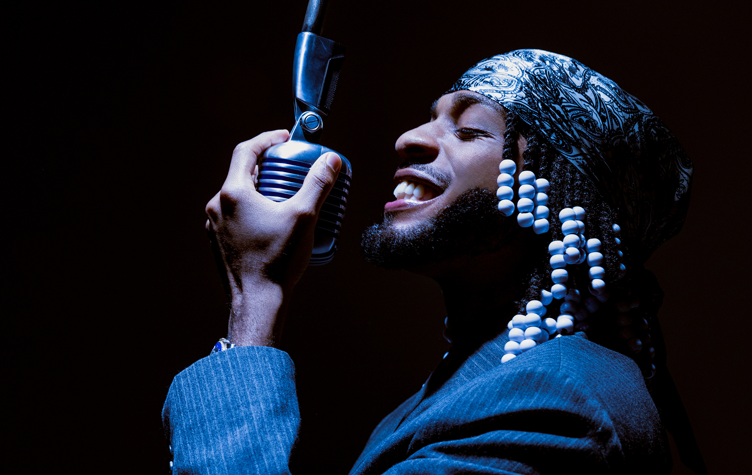 Armani singing into mic