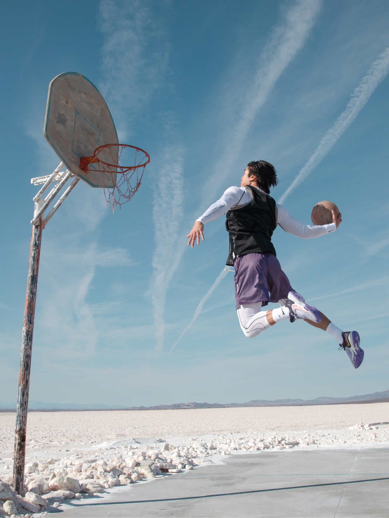A Guy making a basketball dunk