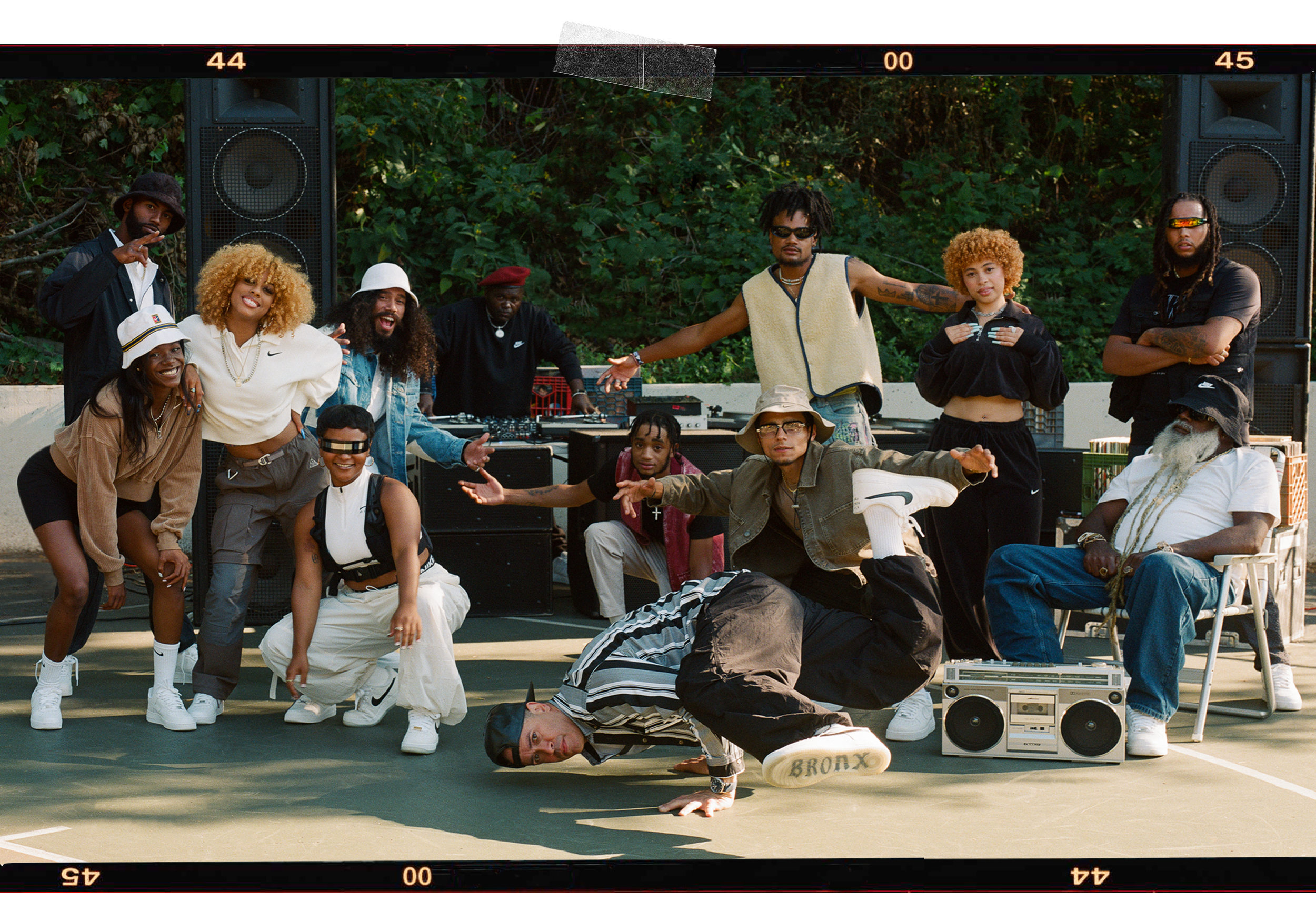 group of people outside dancing and listening to music