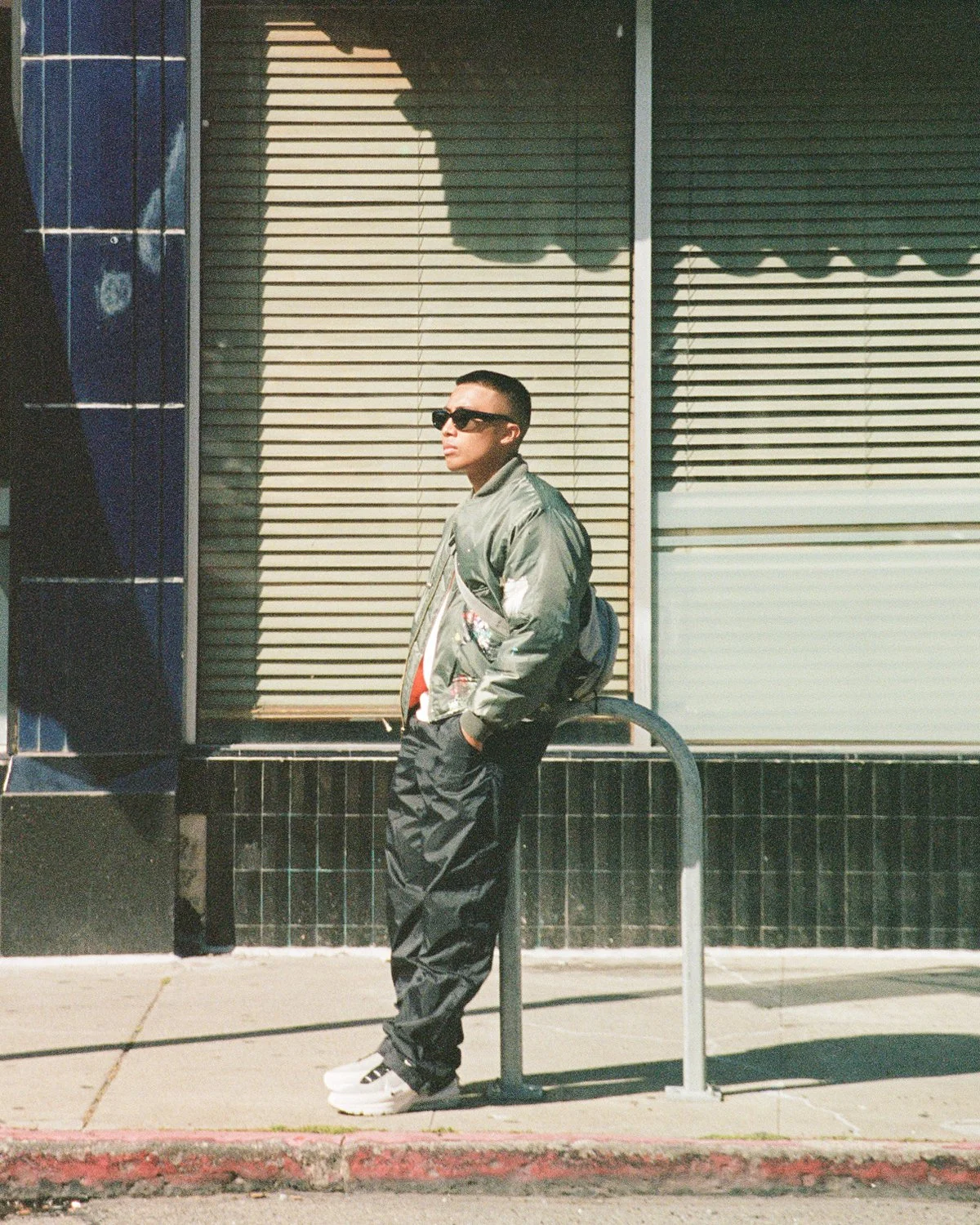 Man wearing Nike Air Max on side of the street