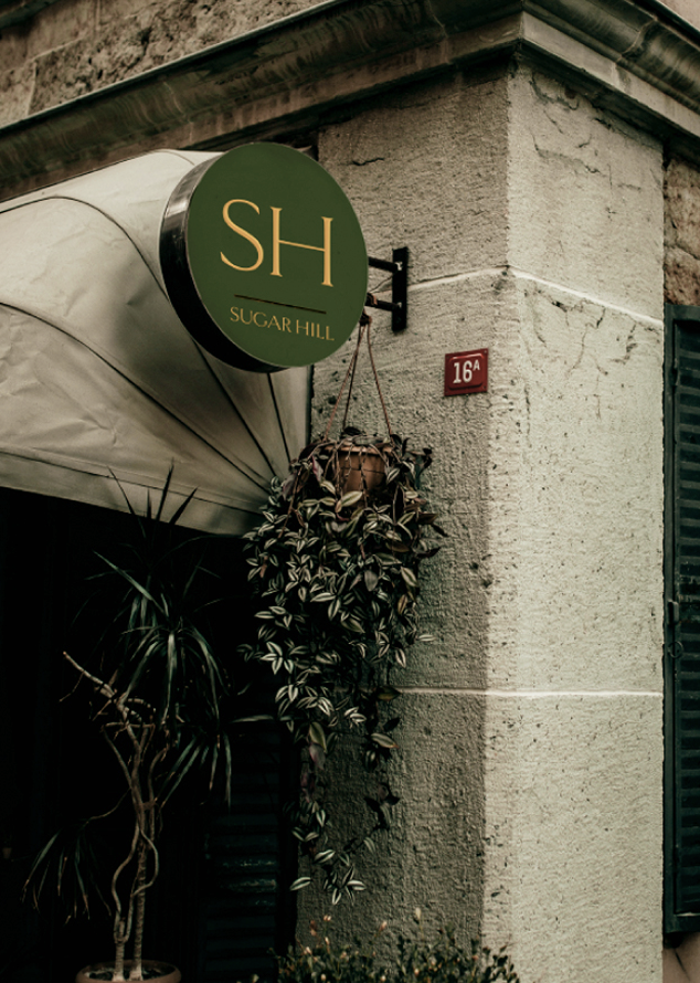 Sugar Hill circle signage with the secondary logo