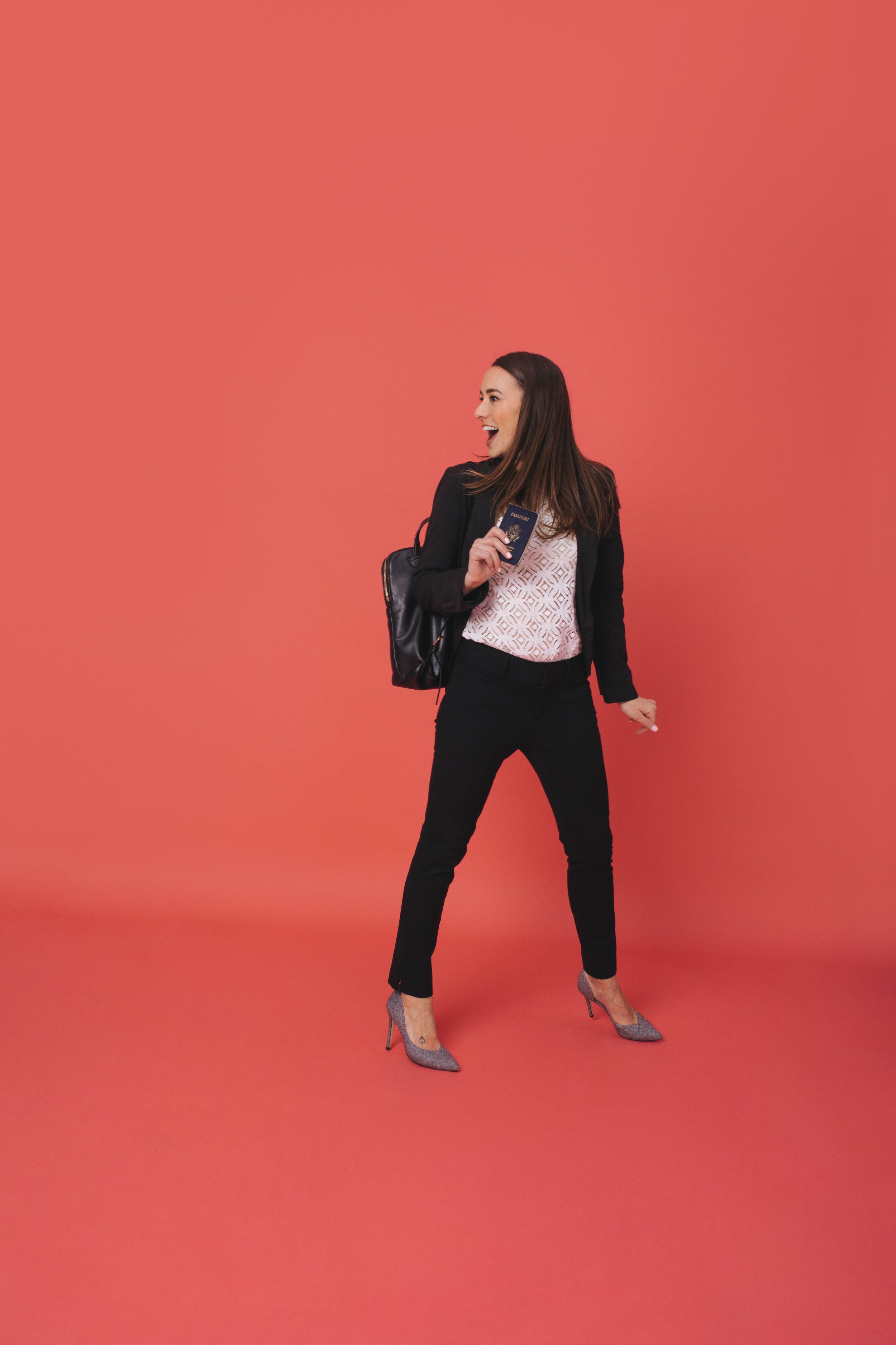 Mom on the go in front of coral background