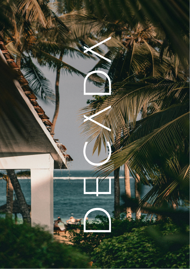 Beach image with the white logo of Decada on top laid vertically