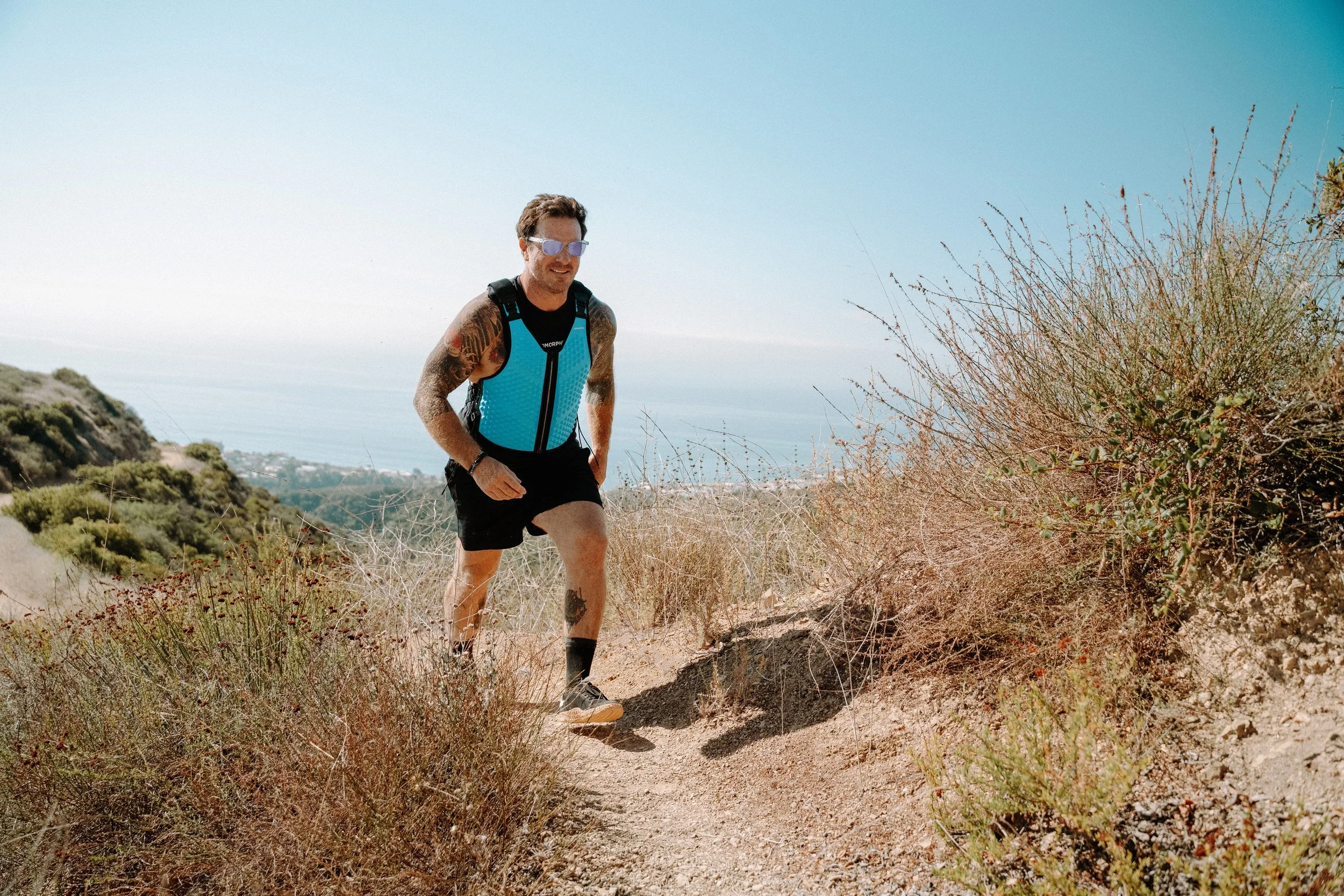 Seamus Mullen hiking in Omorpho vest