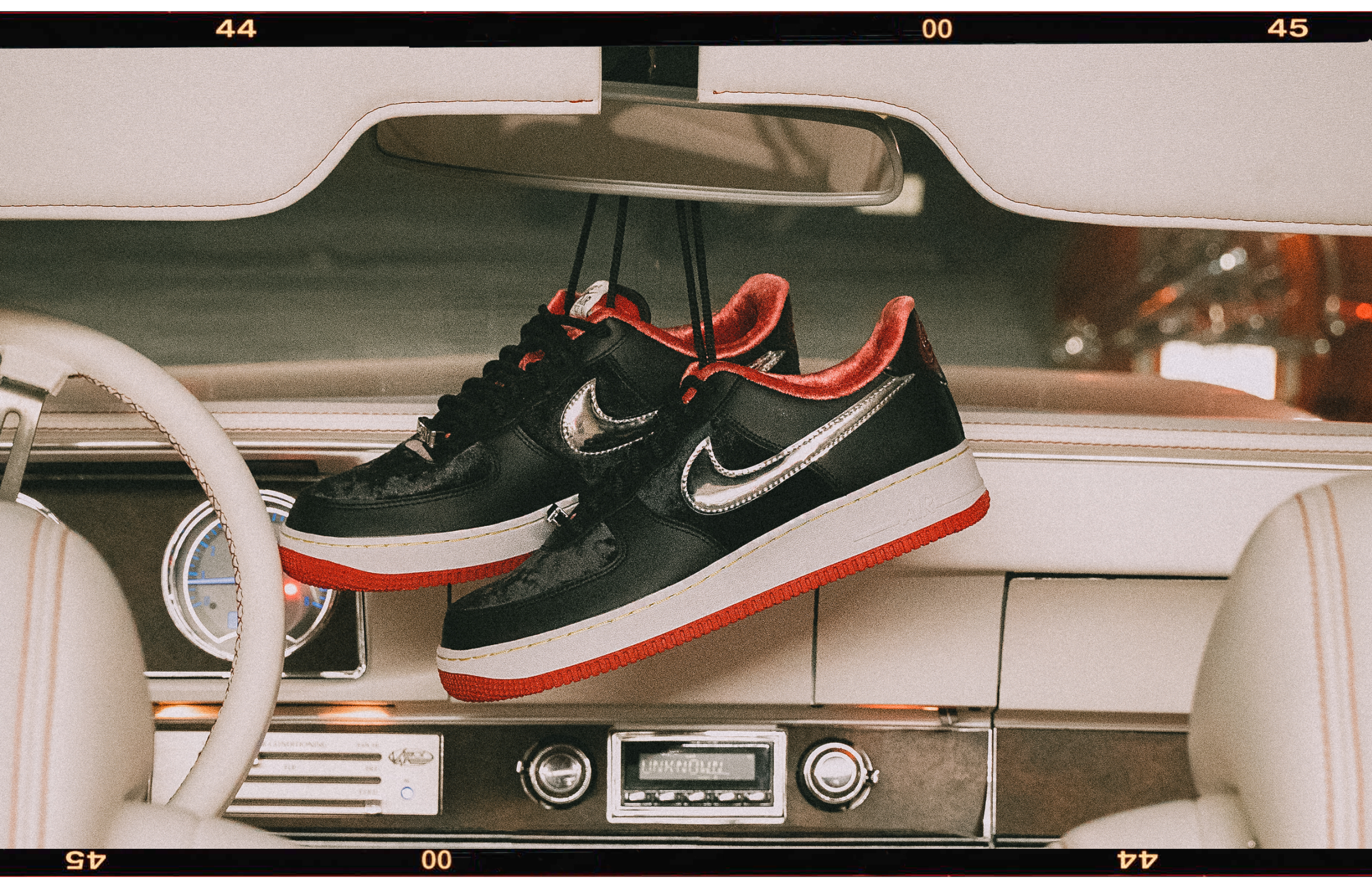 Nike Air Force 1's hanging from car mirror