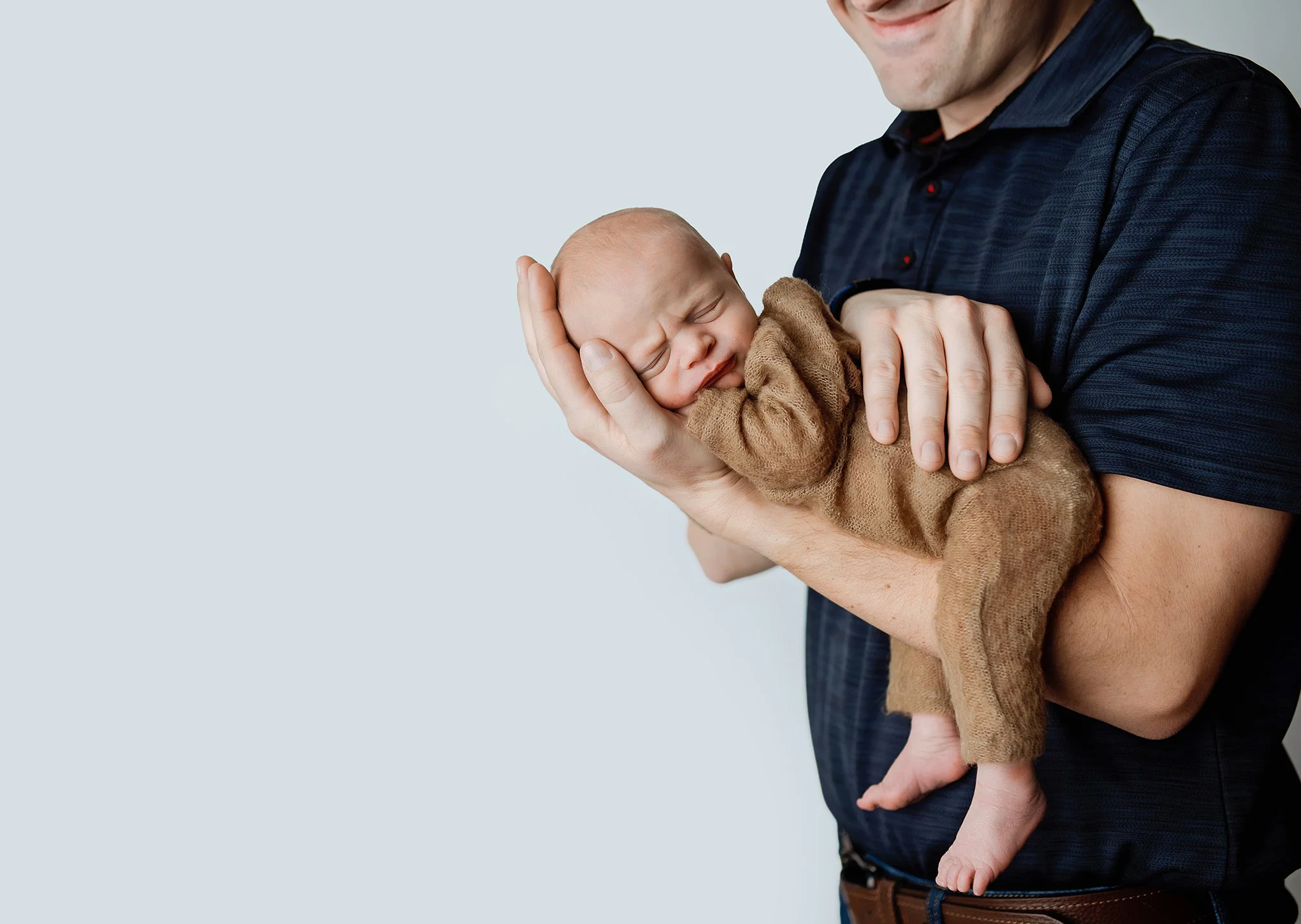 newbornwithdadphoto.jpg