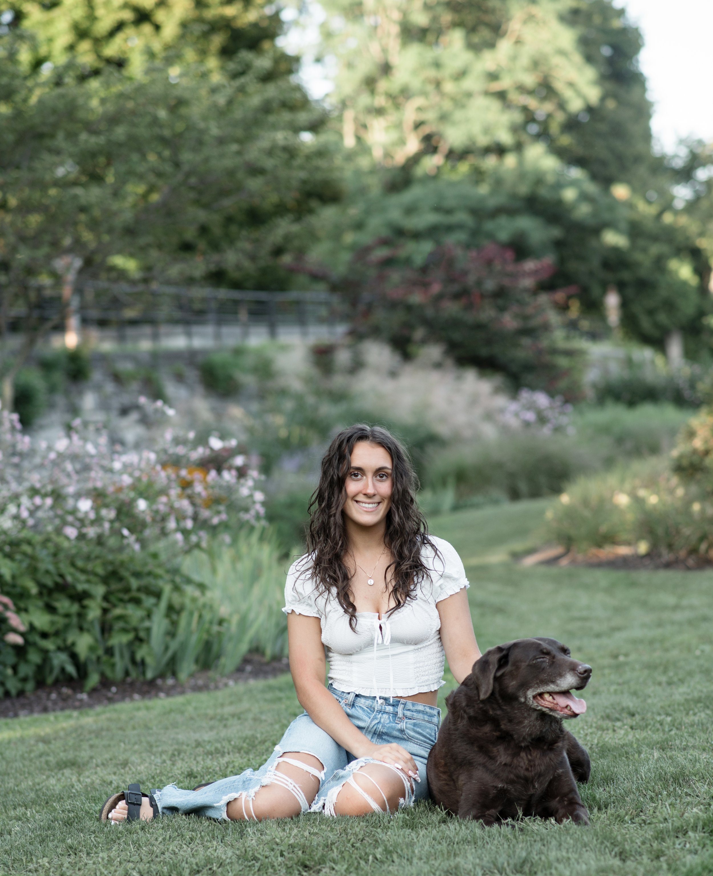Senior girl with her dog during her photoshoot