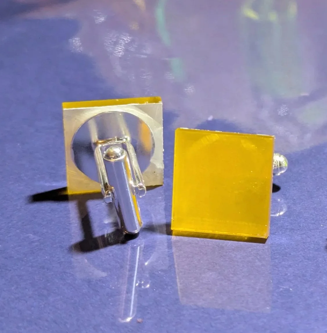 Red circuit board cufflinks on display