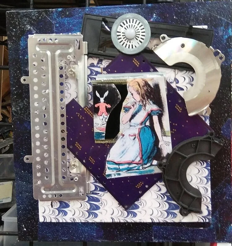Mixed media artwork featuring mechanical parts, abstract patterns, and an illustration of a girl in a blue dress.