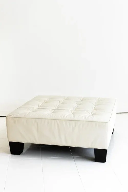 VINTAGE WHITE LEATHER OTTOMAN