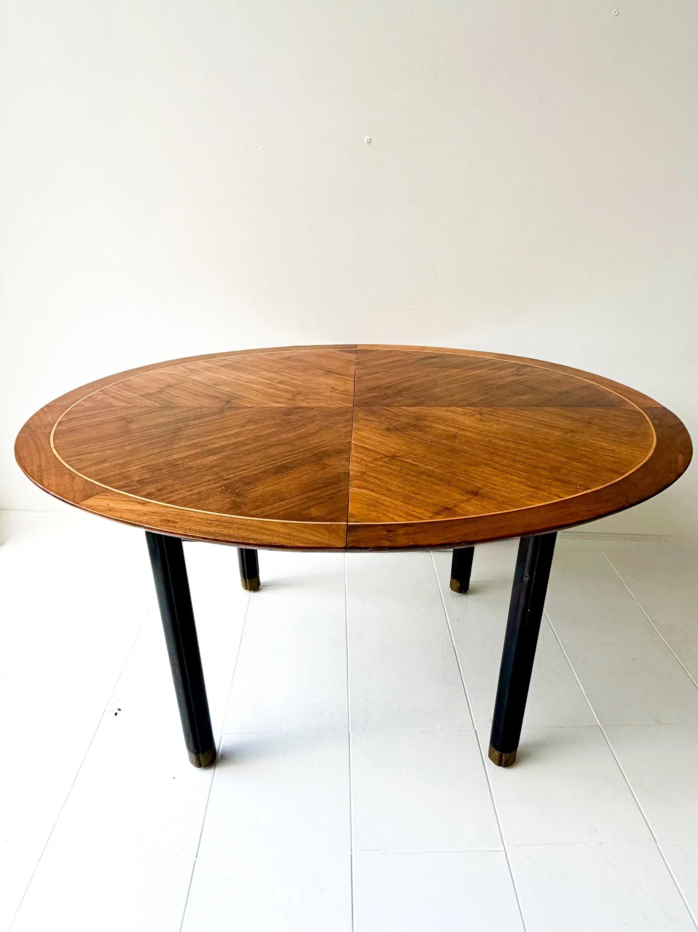 MIDCENTURY OVAL TABLE ON CASTERS BY BAKER