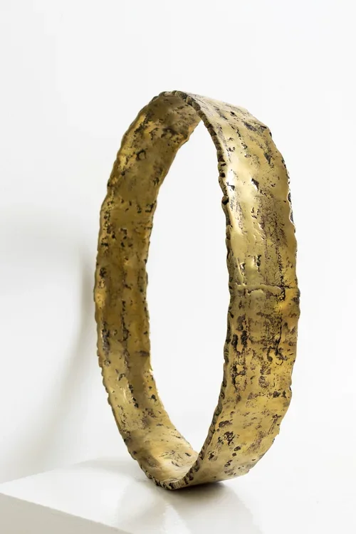 SCULPTURAL HAND FORGED METAL CIRCLE