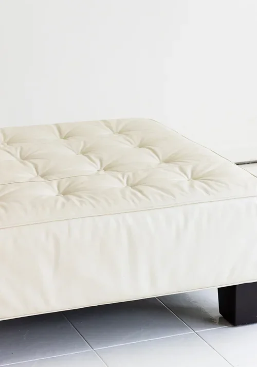VINTAGE WHITE LEATHER OTTOMAN