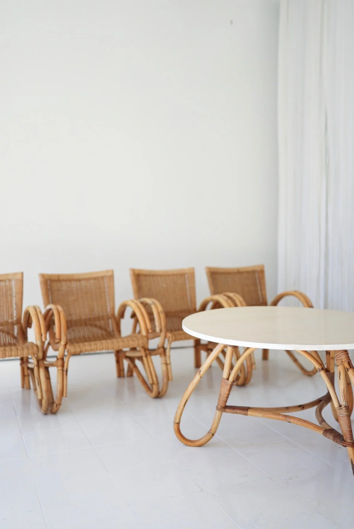 VINTAGE 4 RATTAN CHAIRS AND ROUND TABLE; PARIS FLEA MARKET