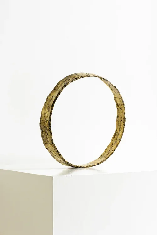 SCULPTURAL HAND FORGED METAL CIRCLE