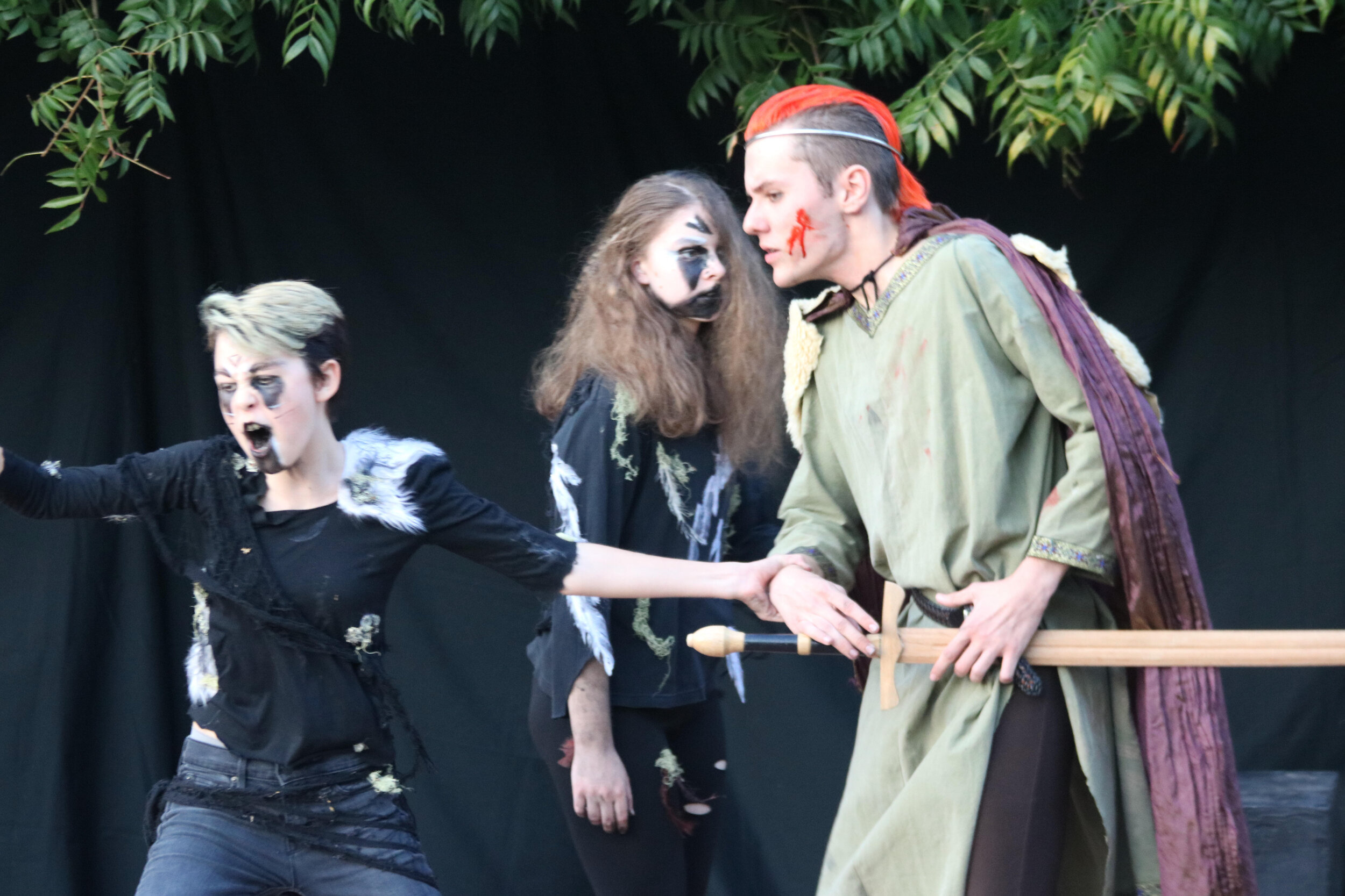 Macbeth (Rory Kinsolving) confronts the witches (Syl Tavernise, Winter Kamas)