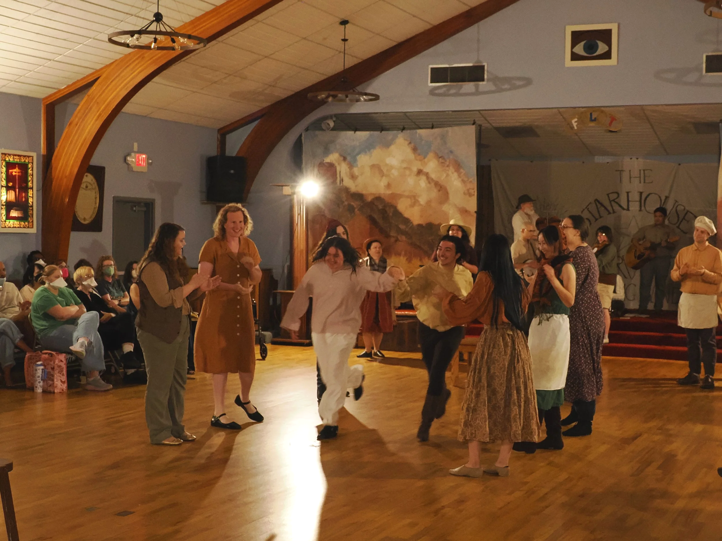 The peasants sing and dance in celebration of the harvest
