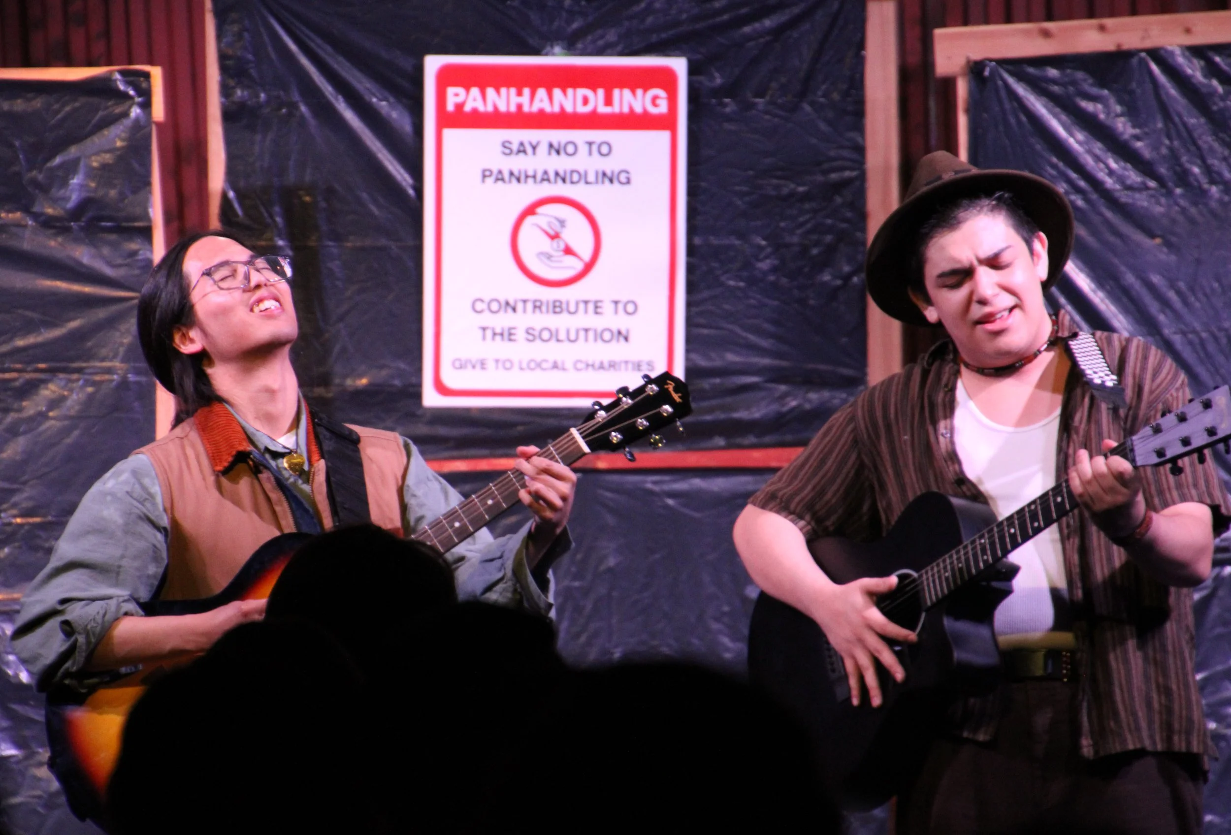 Orlando (Caiden King) busks with his street musician friend, Amiens (Joaquin Gawchua), in defiance of local law.