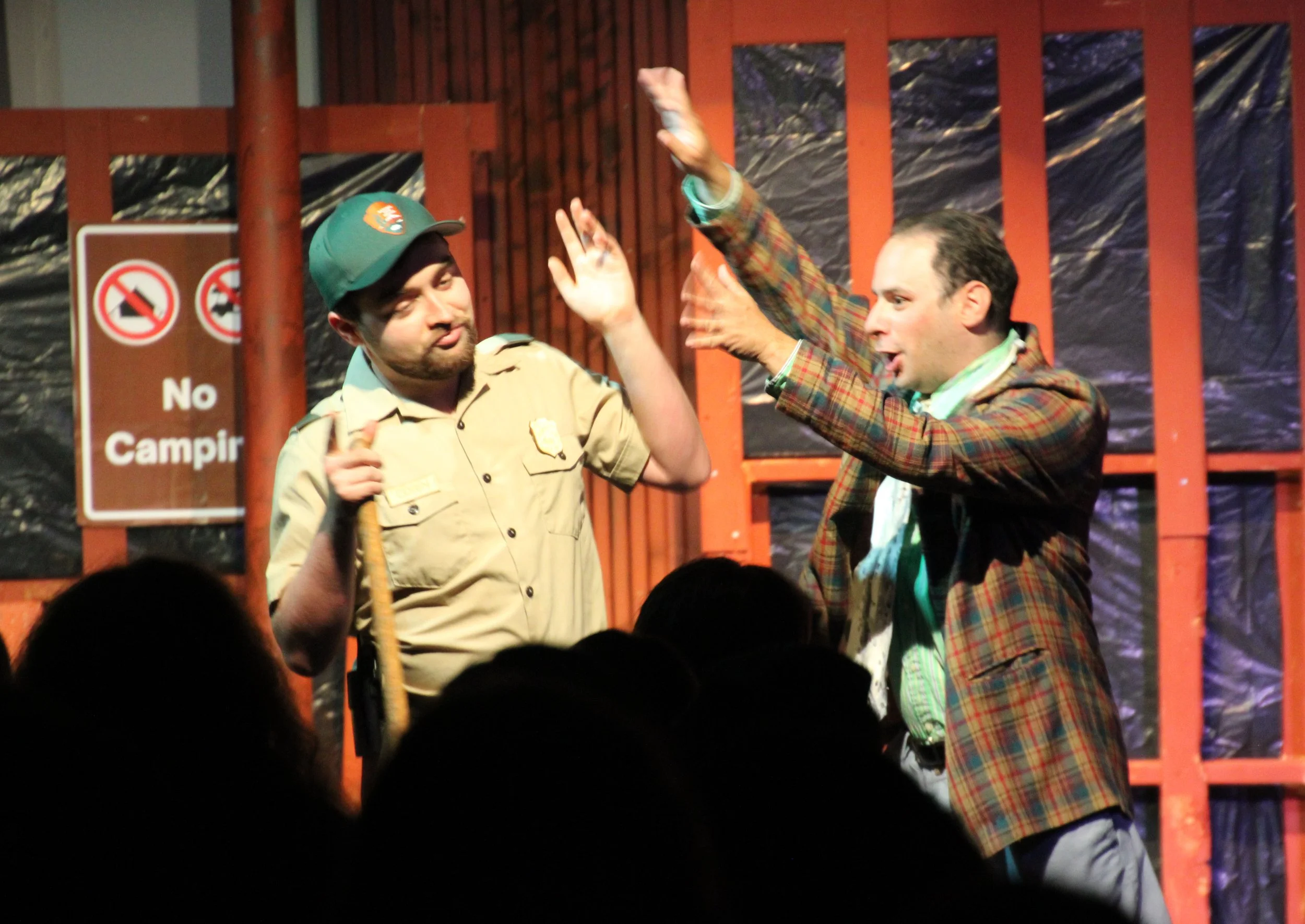 Touchstone (Kenny Silberburg) bothers Corin (Andrew Richmond).