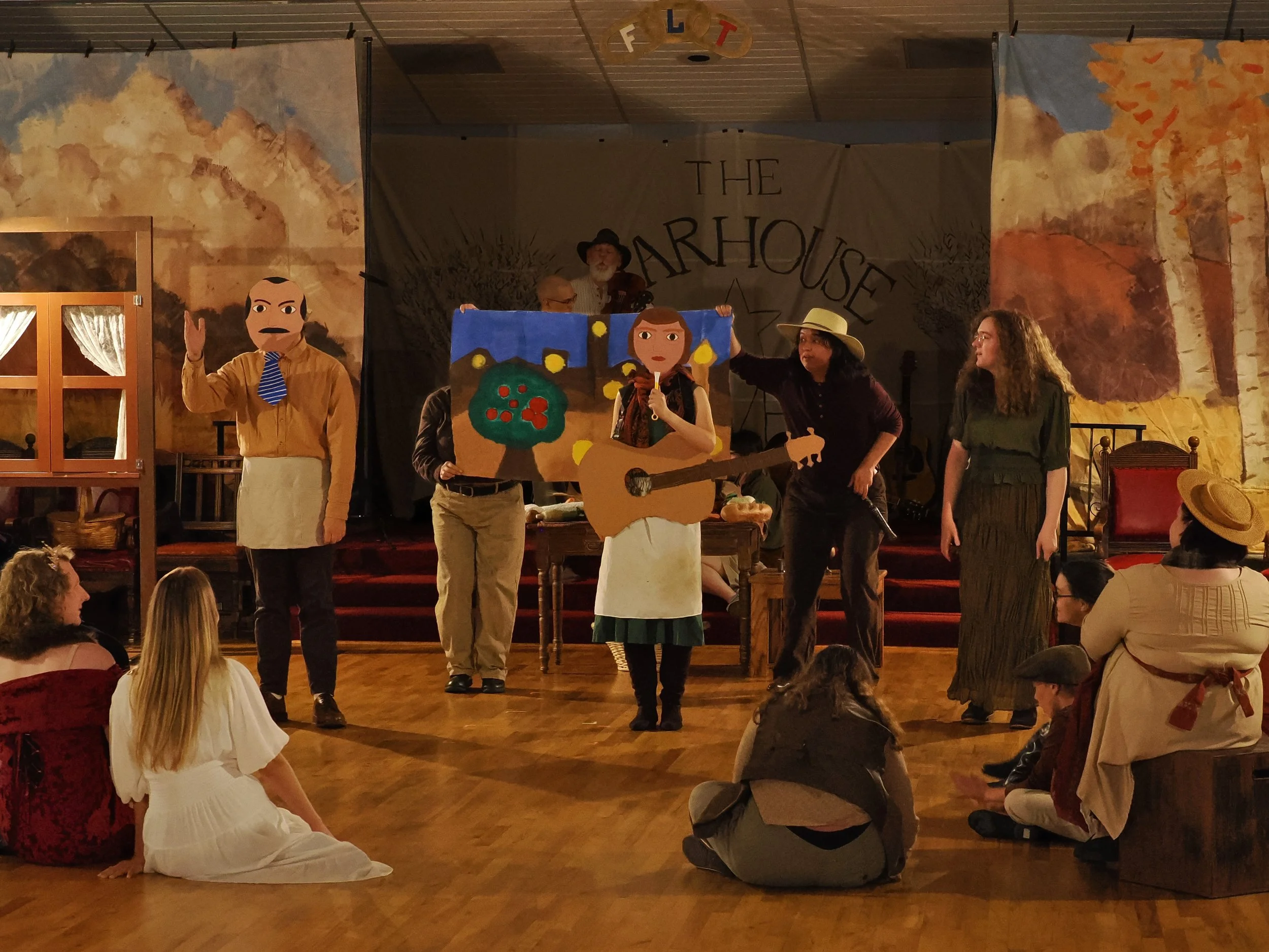At the harvest festival, the peasants put on a ritual play depicting Connie Converse, as portrayed by the Fisherman’s Wife, in conflict with the monstrous Record Executive, as portrayed by the Miller, with the Blacksmith and the Carpenter depicting N