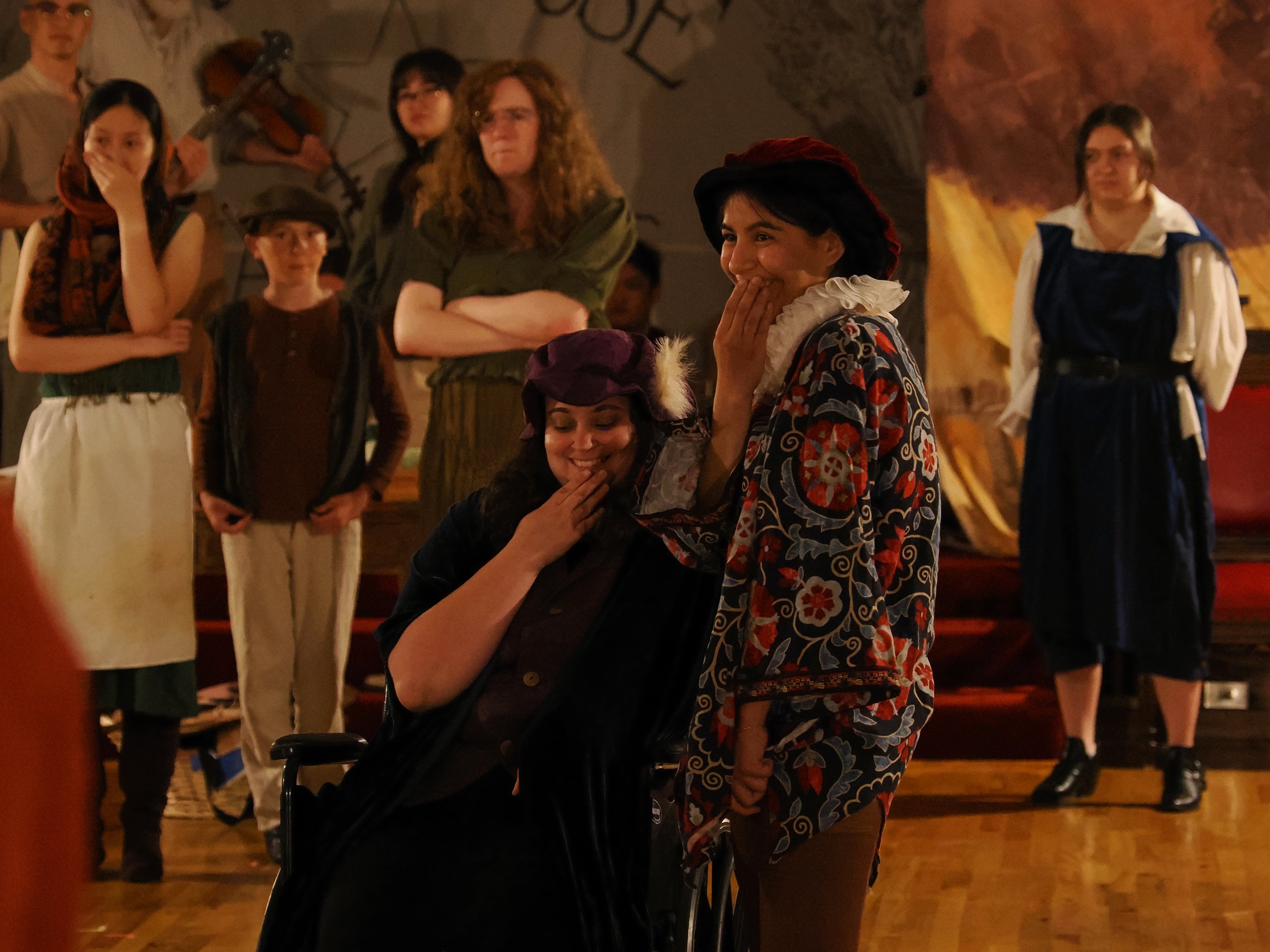 The nobles laugh at Giselle when Albrecht’s deception is revealed, as the other peasants stare in shock and disapproval