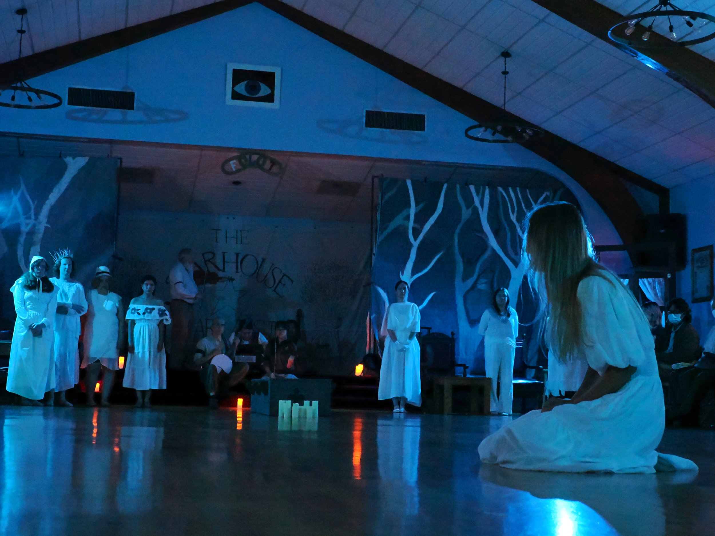 Giselle, now a ghost, mourns her death as the Wilis look on from the trees