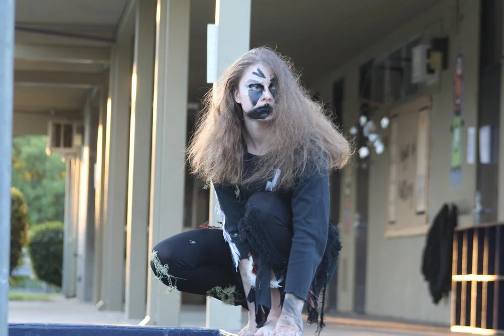 A witch (Winter Kamas) surveys the scene.