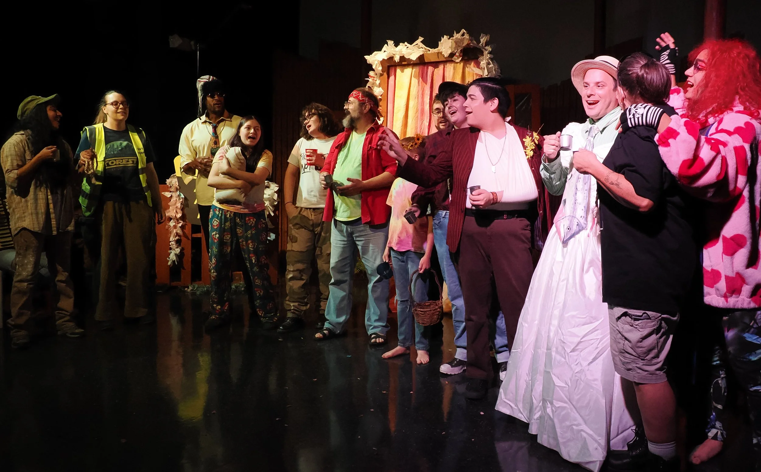 The cast raise their glasses at the wedding (Left to right: Divya Pillai, Molly Buck, Christopher Rozier, Moe Salas-Smith, Francisco "Frankie" Vargas, Barry Smith, Neil Birkle, Andrew Richmond, Quinn Trixx, Caiden King, Kenny Silberburg, Karol-Ann Co