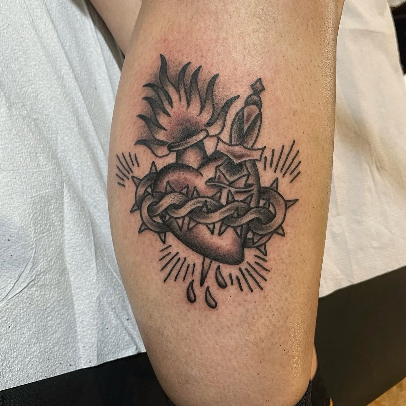 Black and grey sacred heart/dagger made by @jakeacreetattoos 

To schedule appointments with Jake click on his page and send him a DM to get started.