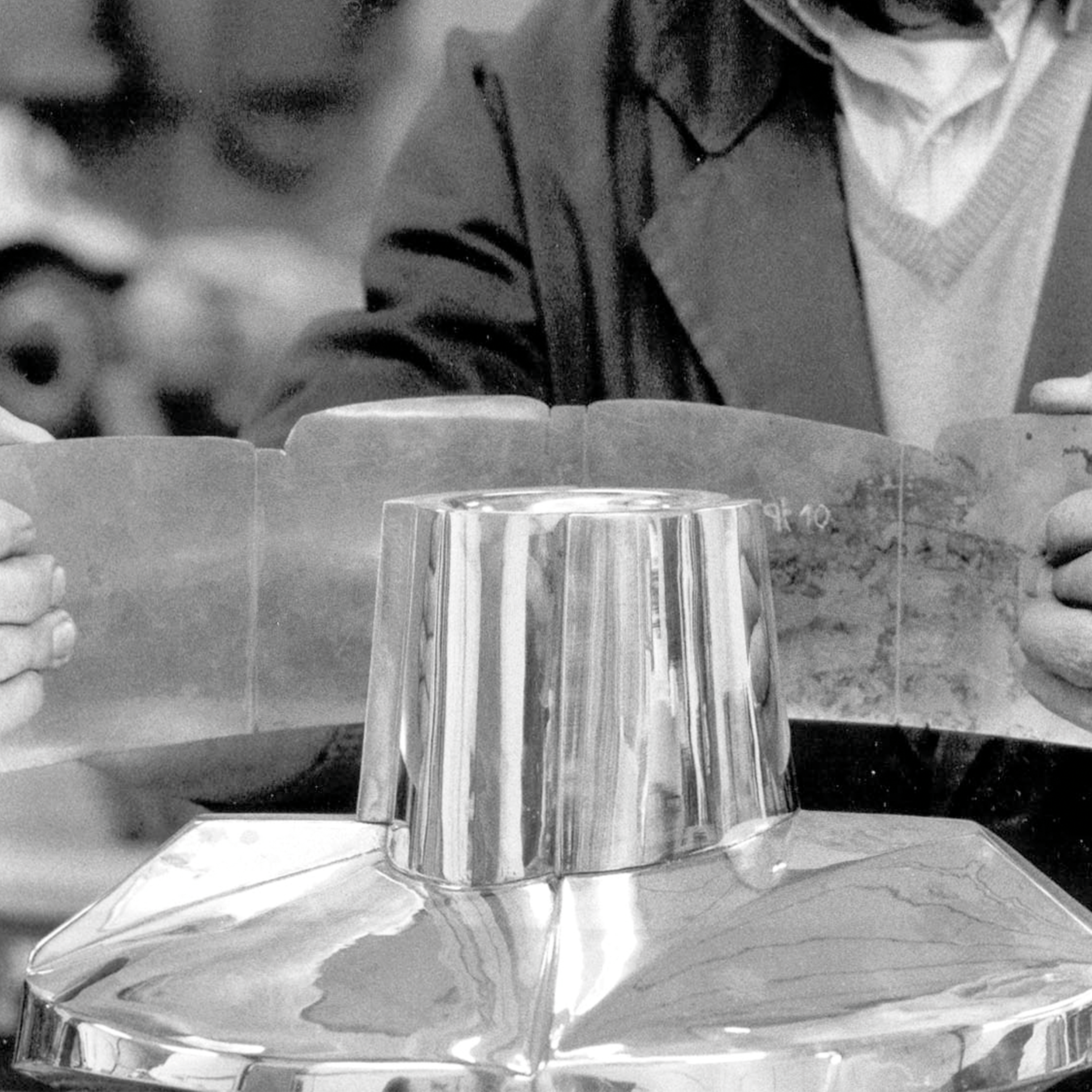 EMBOSSING - Embossing shapes metal from the reverse side by hammering it into an open iron die or mold with an engraved or curved recess.The metal conforms to the pattern, forming raised reliefs or contours.This method simplifies complex shaping whil