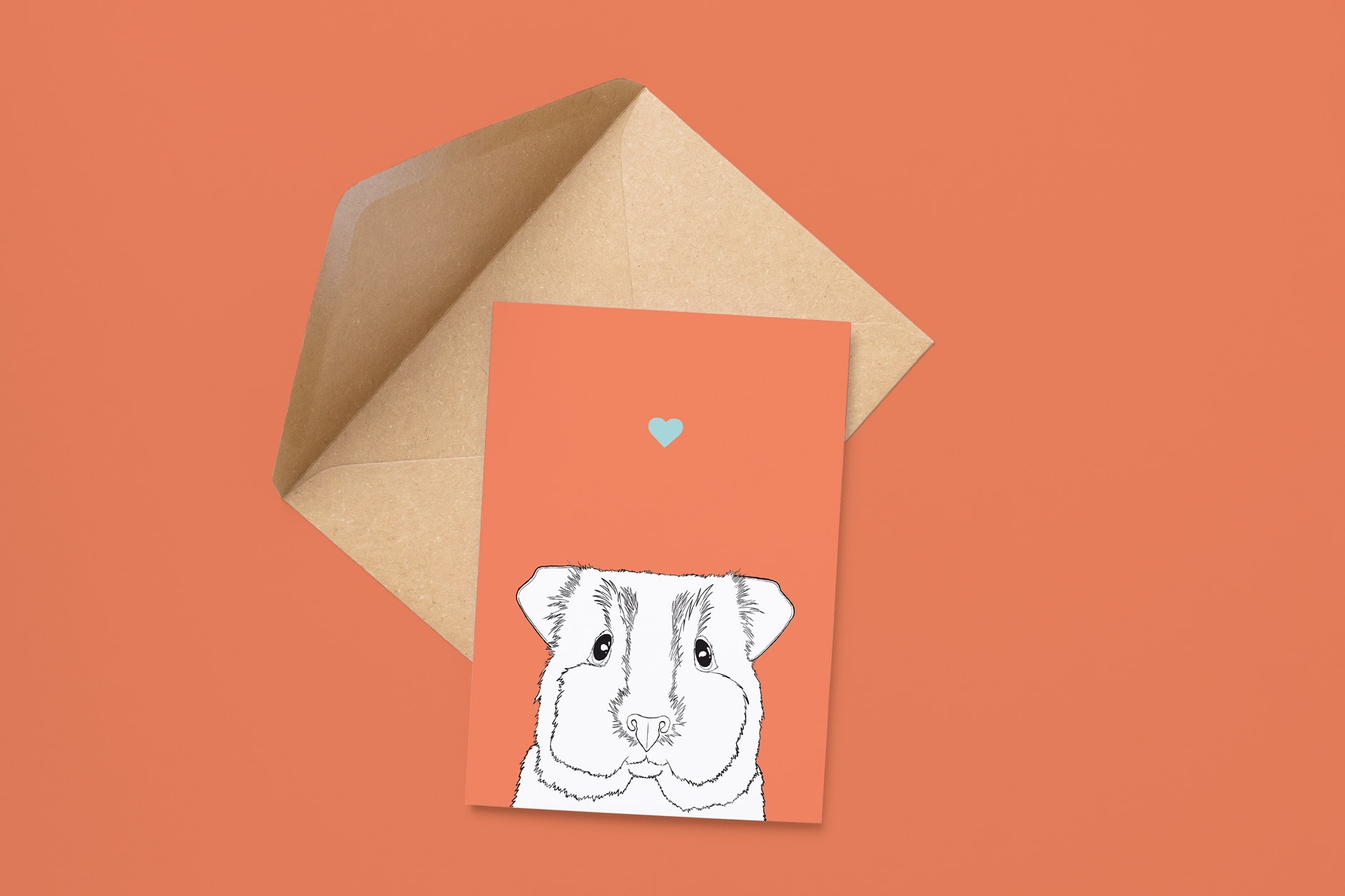 An A6 greetings card on a brown envelope. The card & image have a red background, with a black & white digital illustration of the head & shoulders of a Guinea Pig.