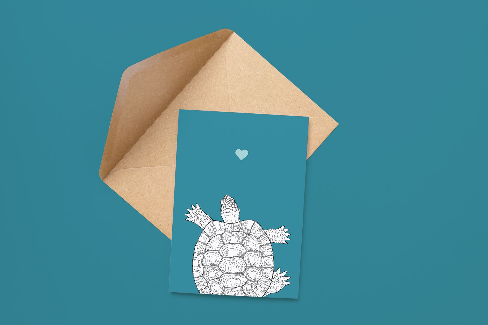An A6 greetings card on a brown envelope. The card & image have a deep teal turquoise background, with a black & white digital illustration of a Tortoise.