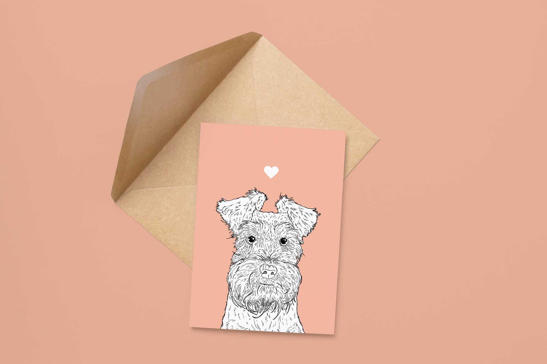 An A6 greetings card on a brown envelope. The card & image have a pale pink background, with a black & white digital illustration of the head & shoulders of a Mini Schnauzer dog.
