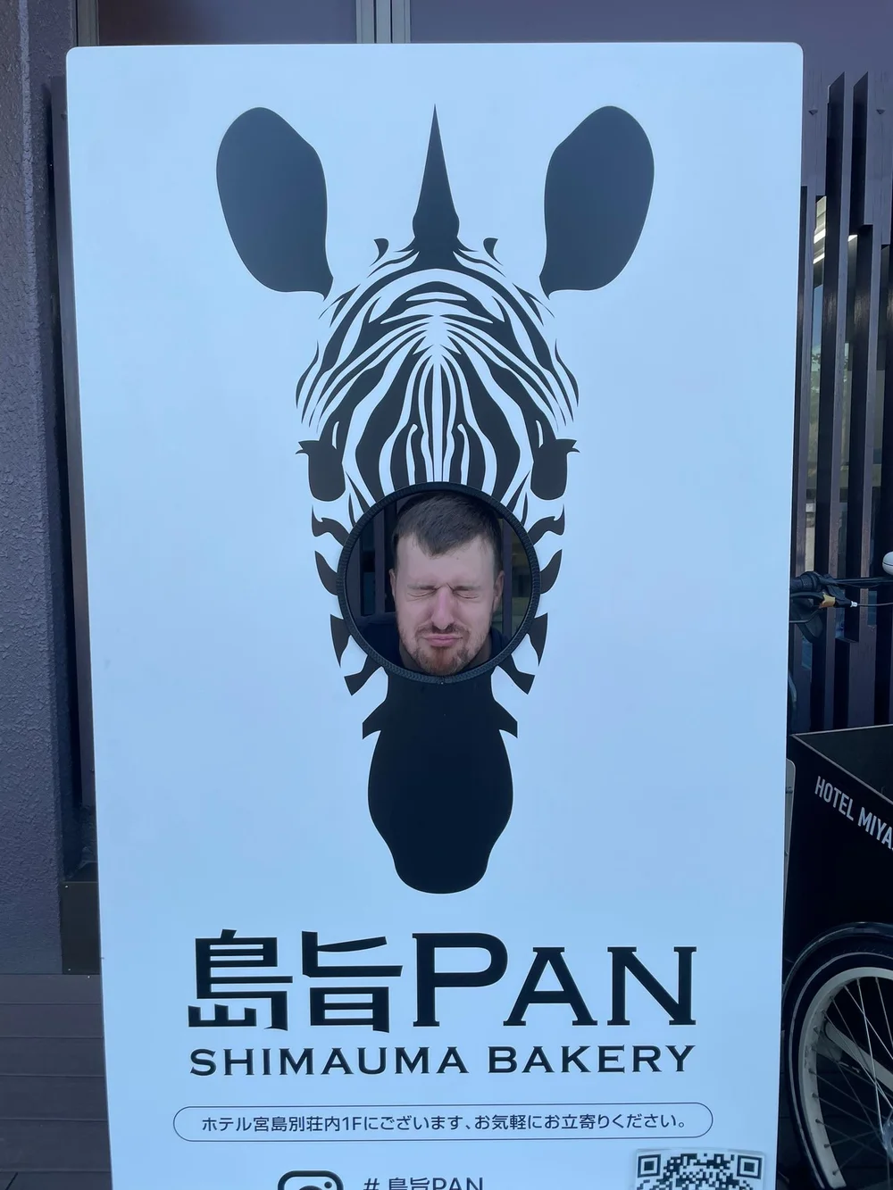 Zebra face-in-hole prop advertising bakery called Pan!