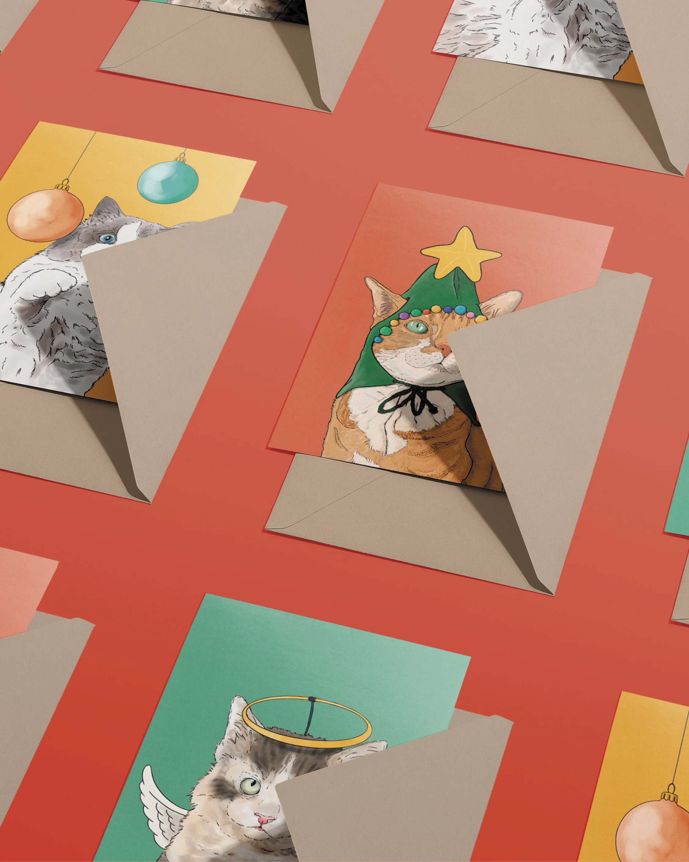 3 x A6 Cat Christmas Cards, bright digital illustrations including a ginger cat in a green Christmas tree hat! Copies tucked into brown envelopes, set on a flat red background.