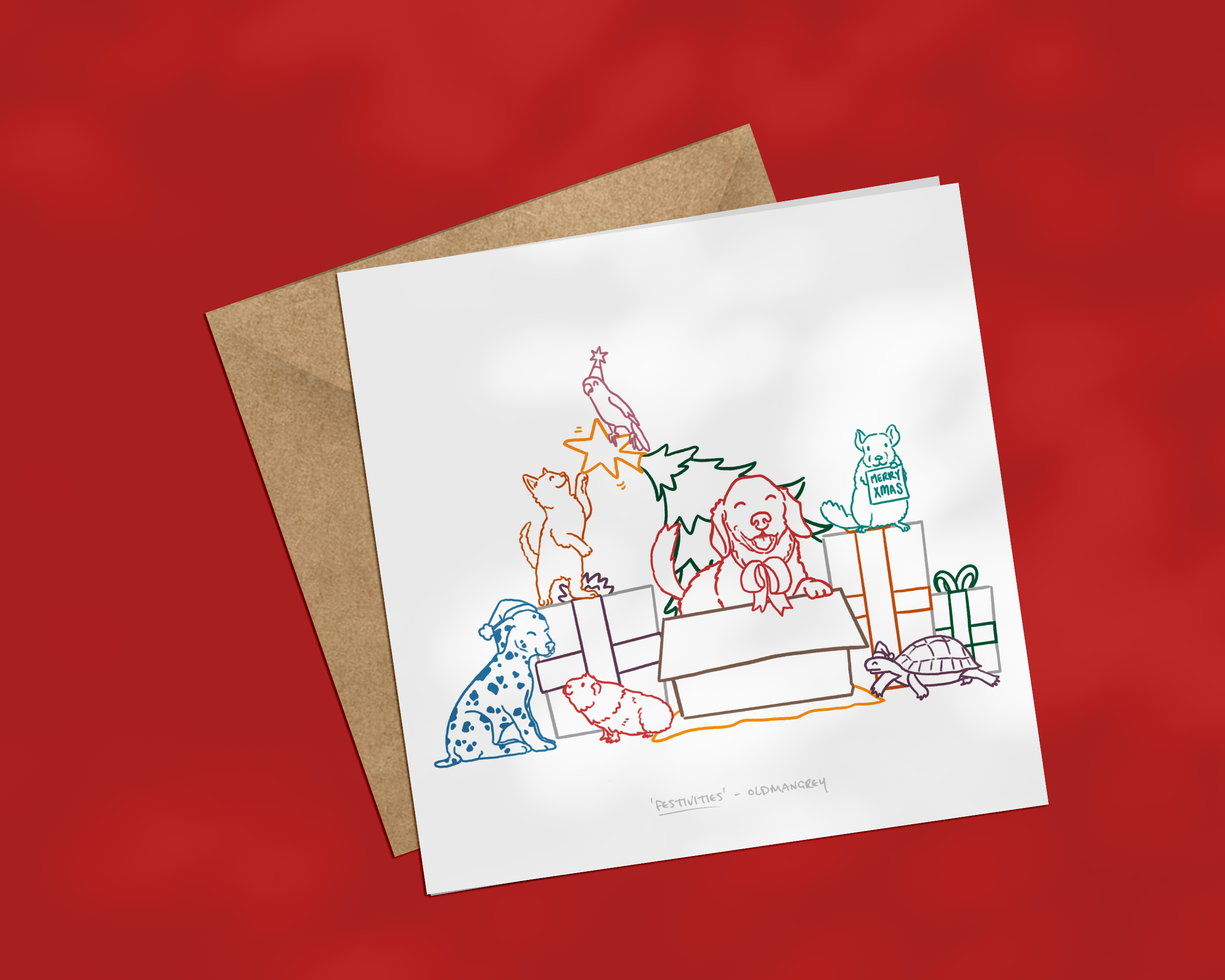 A square Christmas card on a brown envelope, with a colourful image of pets including dog, cat, bird & guinea pig opening presents & bending the tree! The image has a deep red background.