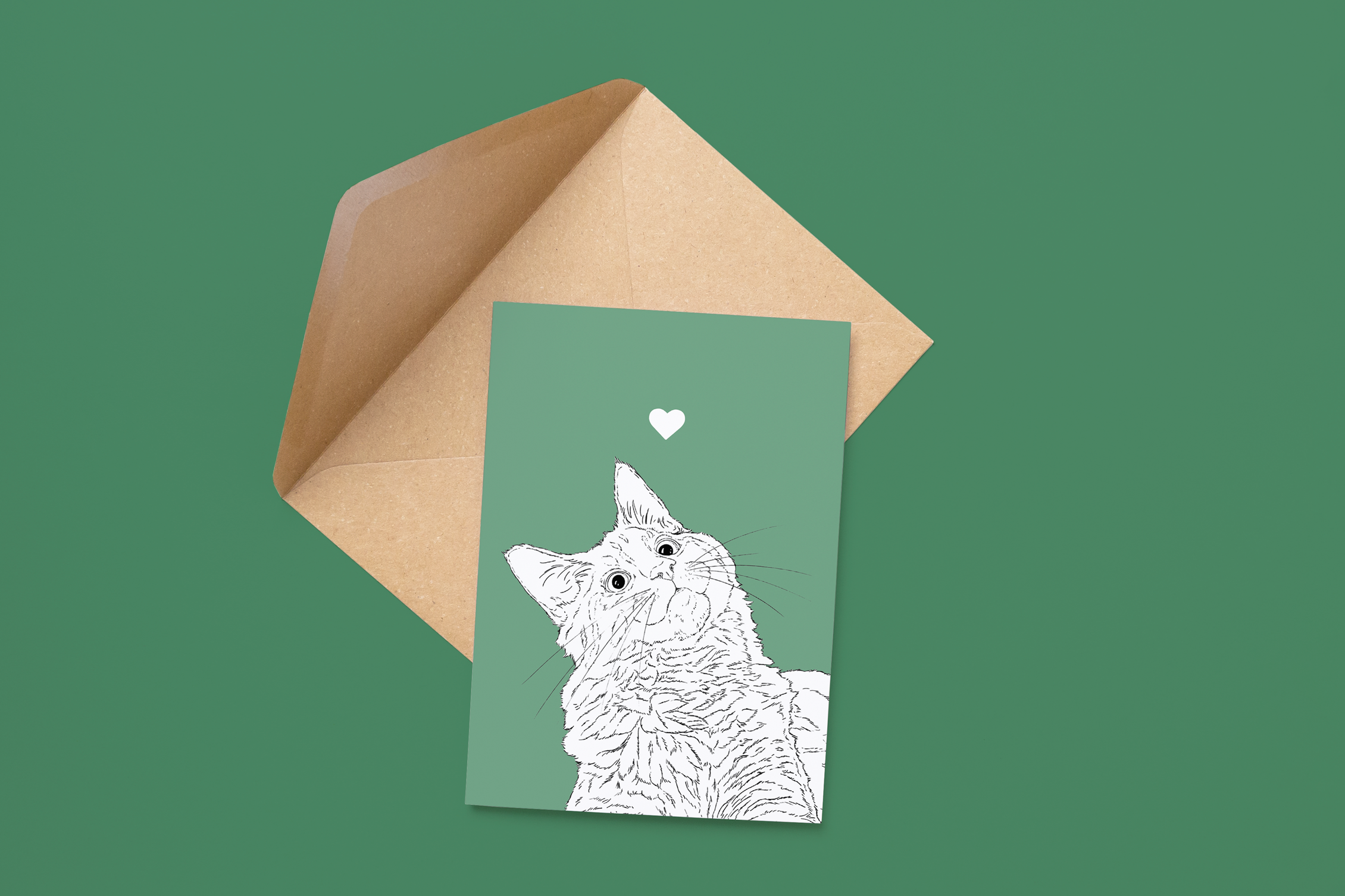 An A6 greetings card on a brown envelope. The card & image have a green background, with a black & white digital illustration of the head & shoulders of a Kitty Cat.