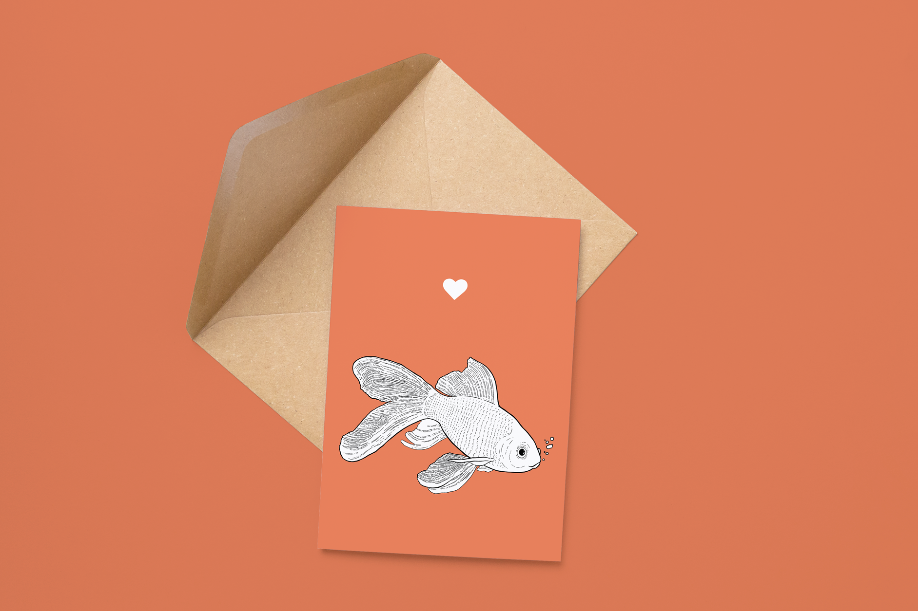 An A6 greetings card on a brown envelope. The card & image have a red background, with a black & white digital illustration of a Goldfish.