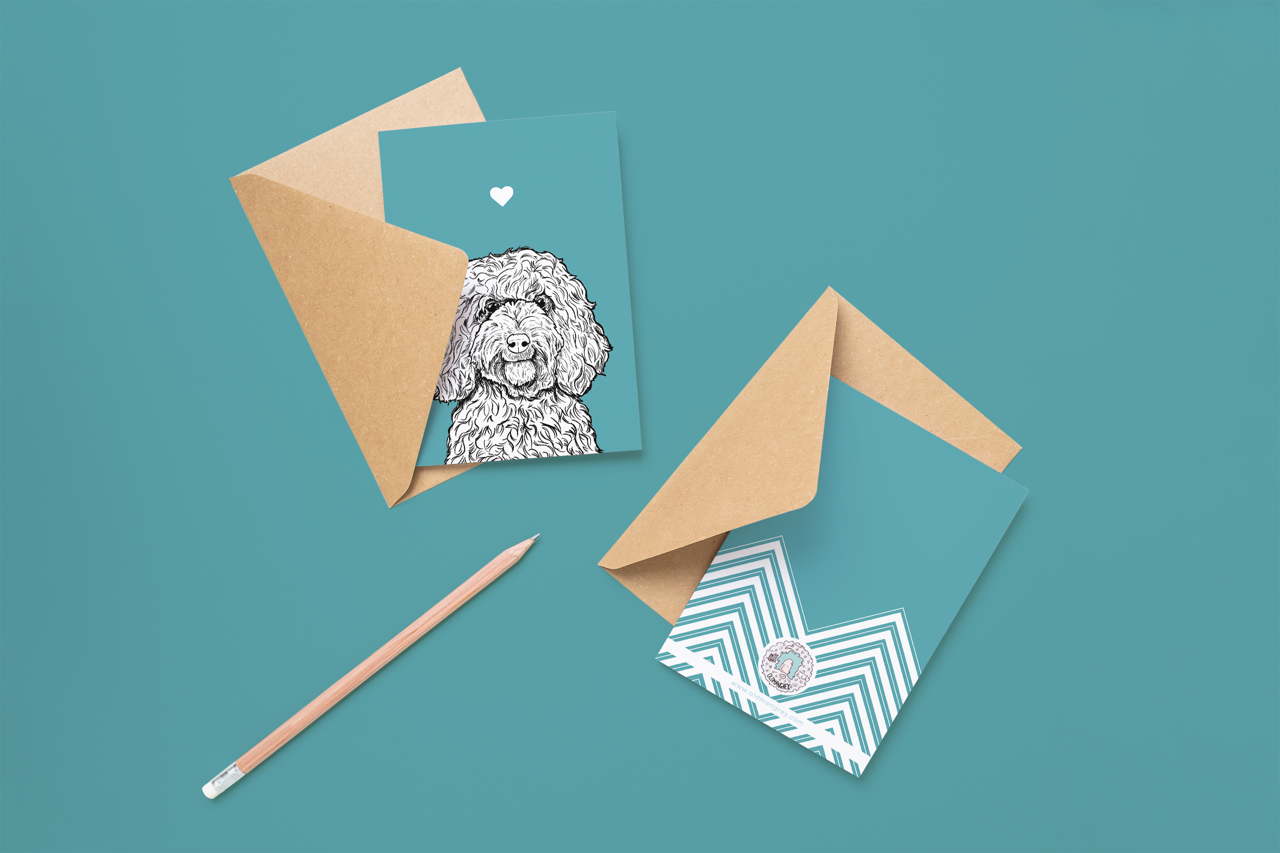 Two cards on brown envelopes, one face up one down. The card and image have a turquoise coloured background, with a black & white digital illustration of the head & shoulders of a Cockapoo dog.